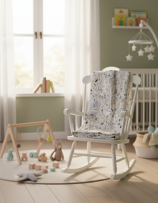 Turkish cotton baby blanket with whimsical road pattern displayed on nursery rocking chair